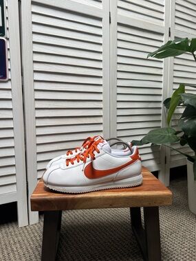 Nike White Sneakers with Orange Swoosh and Laces